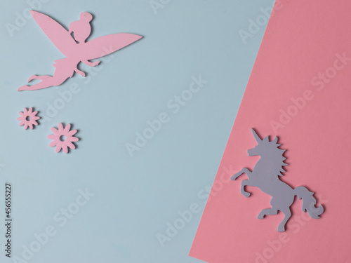 Top view flatlay lie concept view of little small Fairy and , Unicorn color background angel, background for children's party, fairy tale, Unicorn