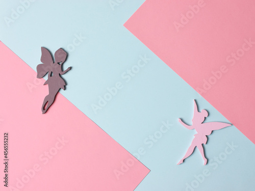 Top view flatlay lie concept view of little small Fairy, color background angel, background for children's party, fairy tale