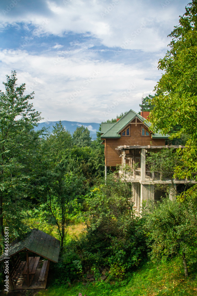 View over rural houses and Carpathian mountains in Yaremche, Ukraine.