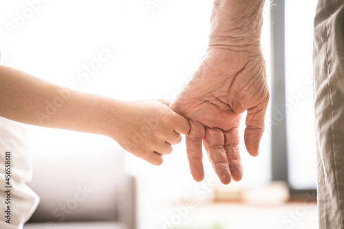 Фотография Grondson holding hand of his grandfather