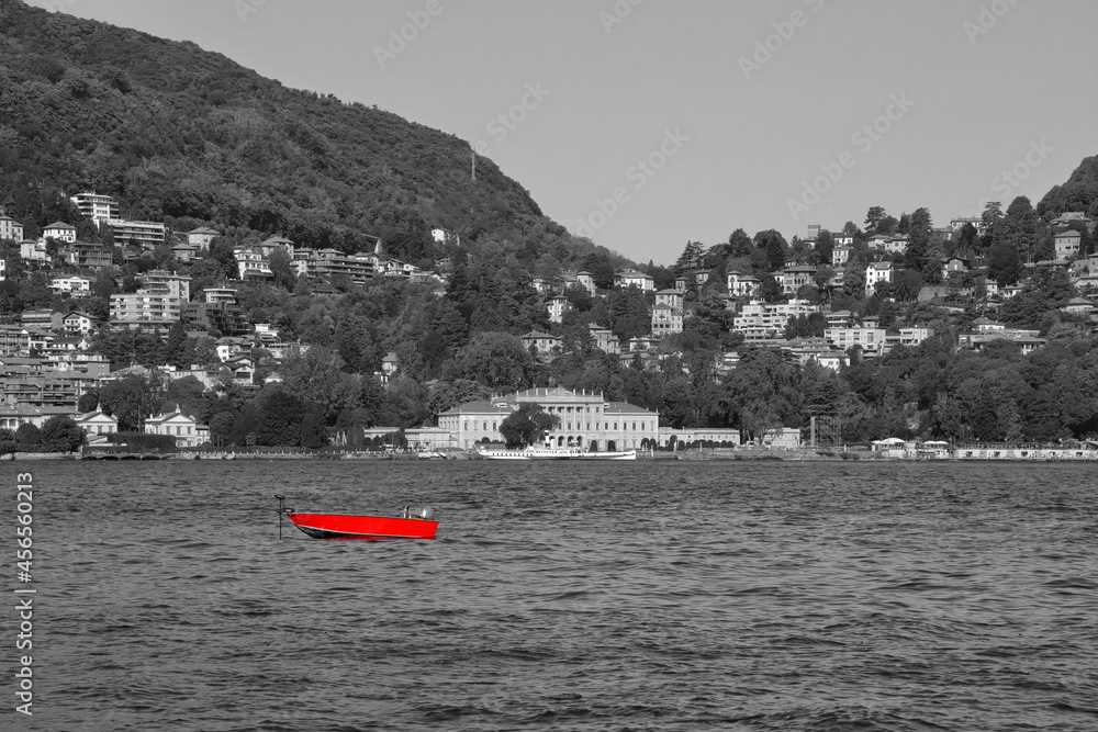 Barca rossa sul lago di Como, Red boat in the lake of Como, Italy 