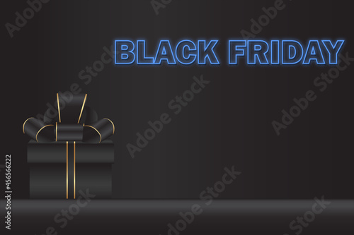 Nice black friday concept focused on gift with bow and neon lettering on dark background.