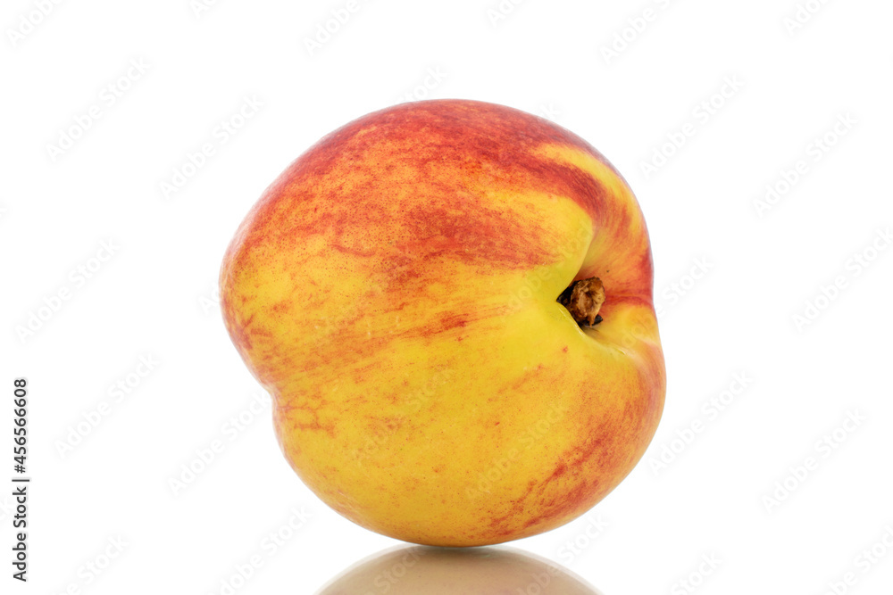 One ripe nectarine, close-up, isolated on white. One ripe nectarine, close-up, isolated on white.