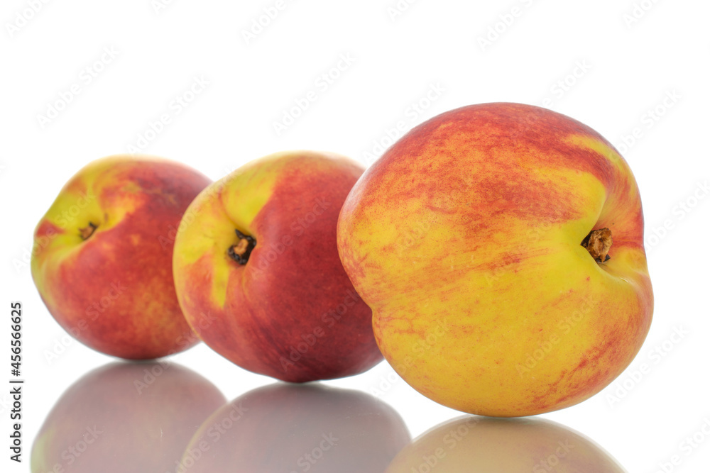 Three ripe nectarines, close-up, isolated on white. Three ripe nectarines, close-up, isolated on white.