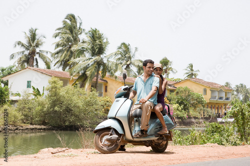 Fotografie Couple on moped