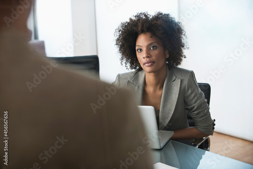 Businesswoman listening in meeting
