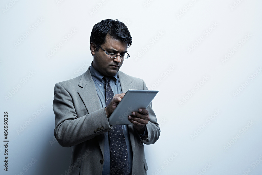 Studio portrait of businessman with digital tablet Studio portrait of businessman with digital tablet