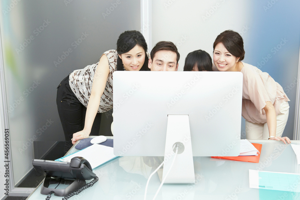 Fototapeta premium Colleagues looking at computer monitor