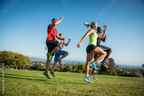 Group of young adults training in field