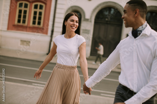 Young multiethnic couple wa...