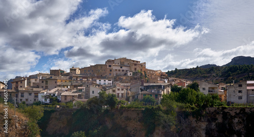 view of the profile of a village from its houses on the mountain with a sky full of clouds