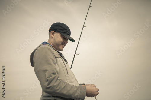Fisherman preparing fishing rod, Truro, Massachusetts, Cape Cod, USA