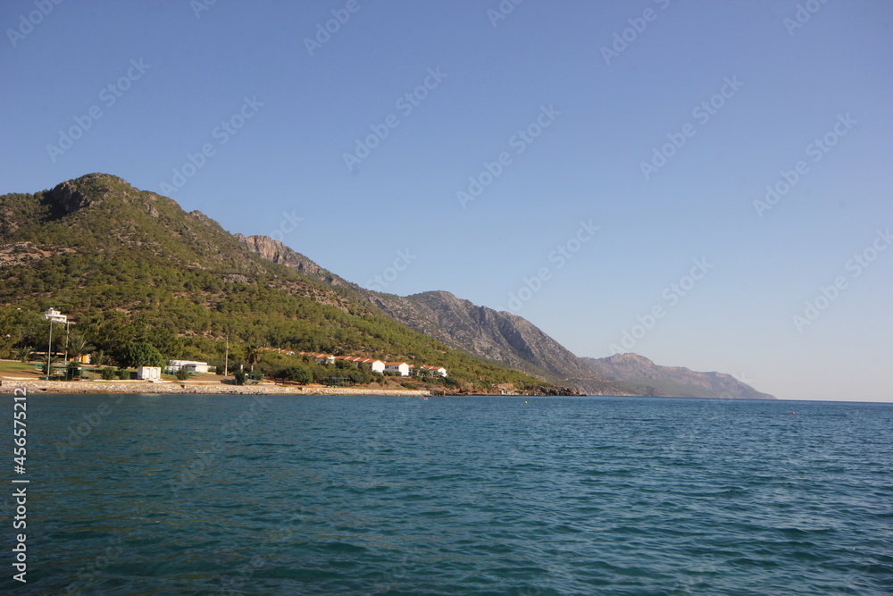 Distant view of the beach on the mountainside, mountain and coast view.