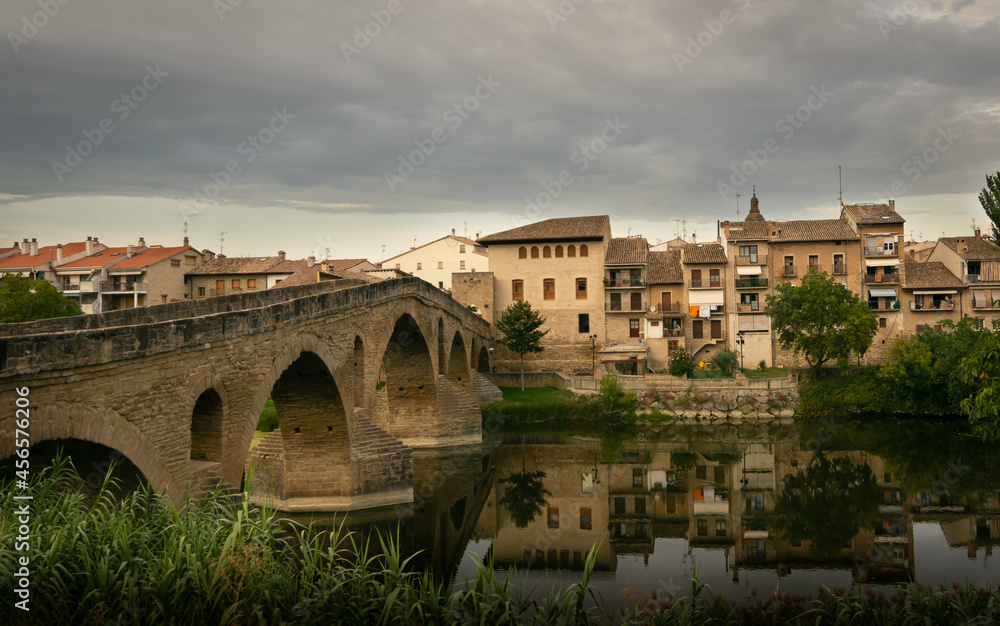 views of the bridge and the typical houses of the town of Puente La Reina.