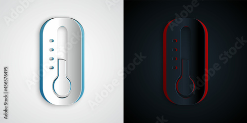 Paper cut Meteorology thermometer measuring icon isolated on grey and black background. Thermometer equipment showing hot or cold weather. Paper art style. Vector