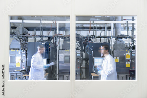 Scientists in lithium ion battery test facility in battery research facility photo
