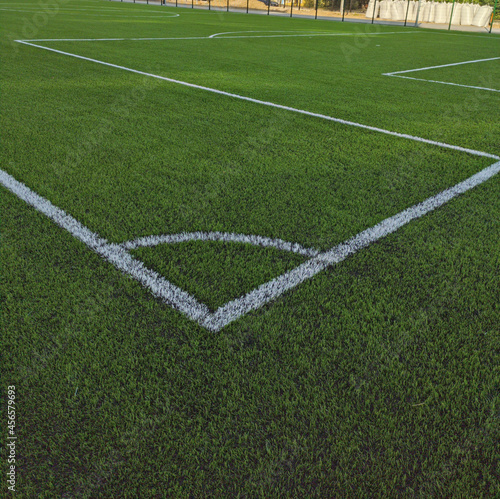 Artificial grass soccer field. Corner kick line of ball and a soccer field   football field   background texture