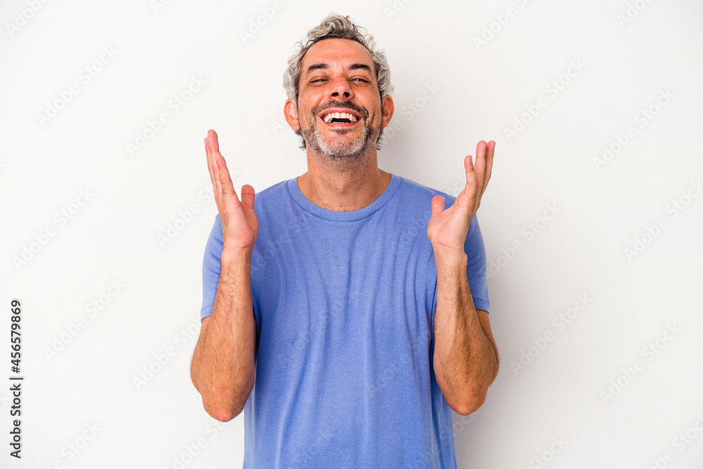 Middle age caucasian man isolated on white background laughs out loudly keeping hand on chest. Middle age caucasian man isolated on white background laughs out loudly keeping hand on chest.