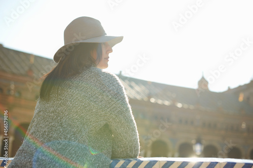 Mature female tourist looking out at Plaza de Espana, Seville, Spain