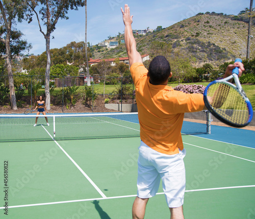 Couple playing tennis