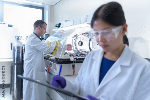 Scientists working in crystal engineering research laboratory