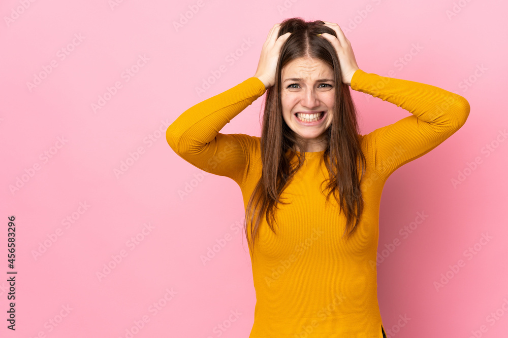 Fototapeta premium Young caucasian woman isolated on pink background doing nervous gesture