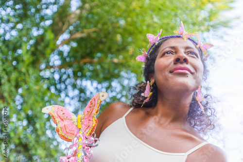 Fotografie Portrait of mature woman dressed as fairy, outdoors