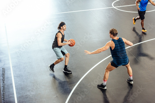 Male basketball player preparing to throw on basketball court