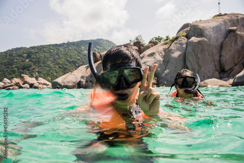 Valokuva Young man and woman snorkelling, Nangyuan Island, Thailand