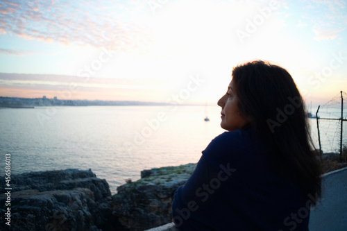 Mature woman gazing out to sea at dusk, Sintra, Portugal © Cultura Allies