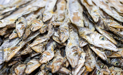 Close up view of a pile of dried sea fish on a seafood market with selective focus