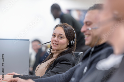 Operators in automotive call centre in car factory photo