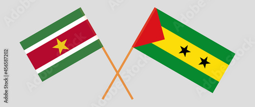 Crossed flags of Suriname and Sao Tome and Principe. Official colors. Correct proportion