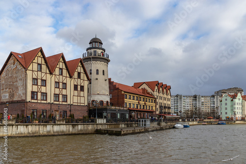 View of Rybnaya Derevnya (Targ Rybny) on the bank of Pergolya (Pergola) river, in Kaliningrad, Russia