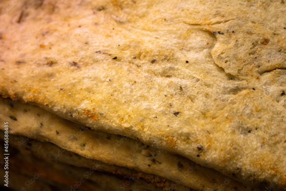 Several square shaped pizzas waiting to be prepared. Food based on wheat flour. Several square shaped pizzas waiting to be prepared. Food based on wheat flour.