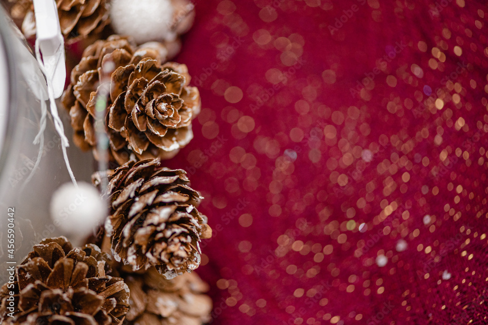 Wax candle near cones on table for Christmas dinner Wax candle near cones on table for Christmas dinner