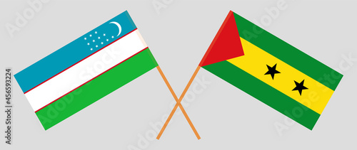 Crossed flags of Uzbekistan and Sao Tome and Principe. Official colors. Correct proportion