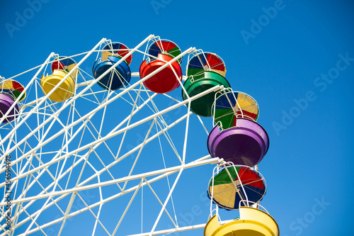 ferris wheel in the park on the blue sky background 