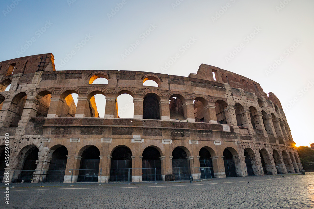 Sunrise at the Colosseum in Rome. Years of history in the eternal city. Roman Empire