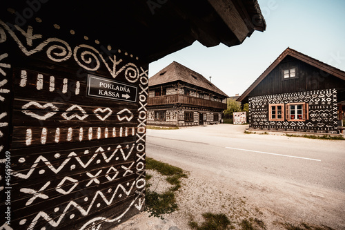 Cicmany, Slovakia - june 08, 2021: Old wooden houses in Slovakia village Cicmany, traditional painted with white paint. Cicmany, Slovakia photo