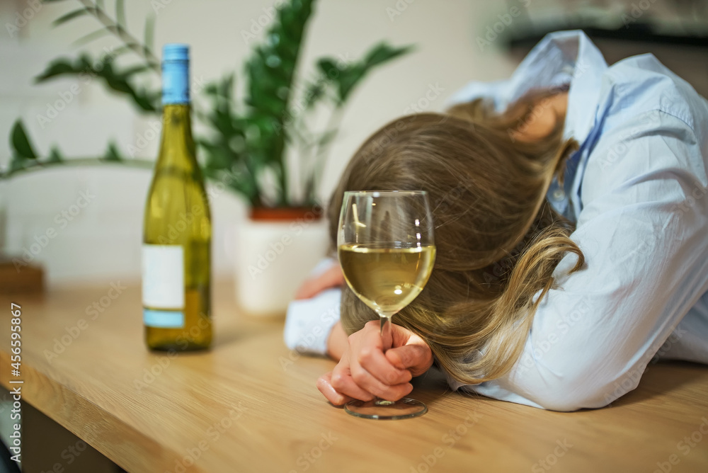 Woman suffering from depression and drinking alcohol. Woman suffering from depression and drinking alcohol.