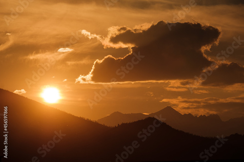 Sunset in the village of Belyashi on the Dzhazator River in the Altai Mountains photo