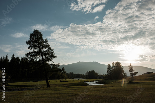 Evening in the village of Belyashi on the Dzhazator River in the Altai Mountains photo