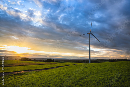 wind turbines farm in sunset