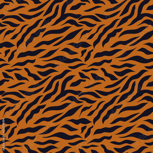 The tiger pattern is a symbol of 2022. Seamless pattern with black stripes on a brown background. Print for modern fabrics  throw pillows  wrapping paper. 