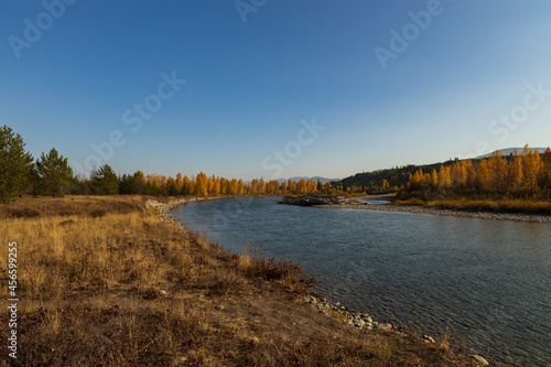 North Fork Flathead River and colorful Fall foliage, Glacier National Park, Montana, USA