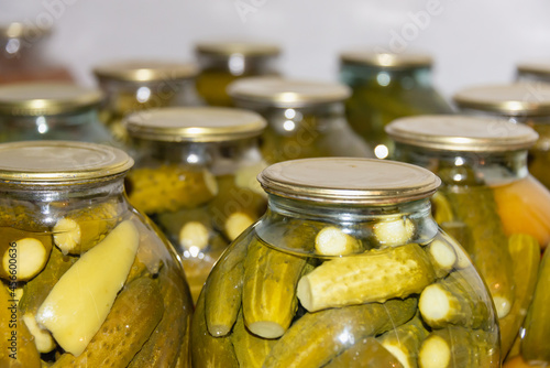 Jars of pickles on a shelf in the cellar, basement.