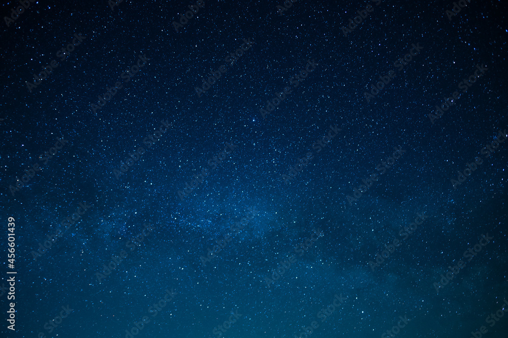 Fototapeta premium Starry night sky. Milky Way. Twinkling stars. Mysterious, majestic beauty, silence. Background. Texture. Wallpaper. Minimalism. There are no people in the photo. Astronomy, astrography, space.