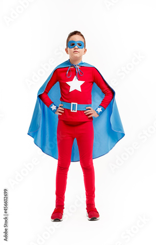 Kid in superhero costume and mask