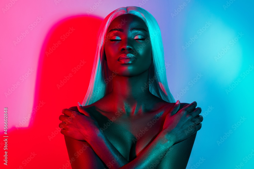 Photo of young stunning gorgeous calm peaceful afro girl hug embrace herself body care isolated on shiny vivid background